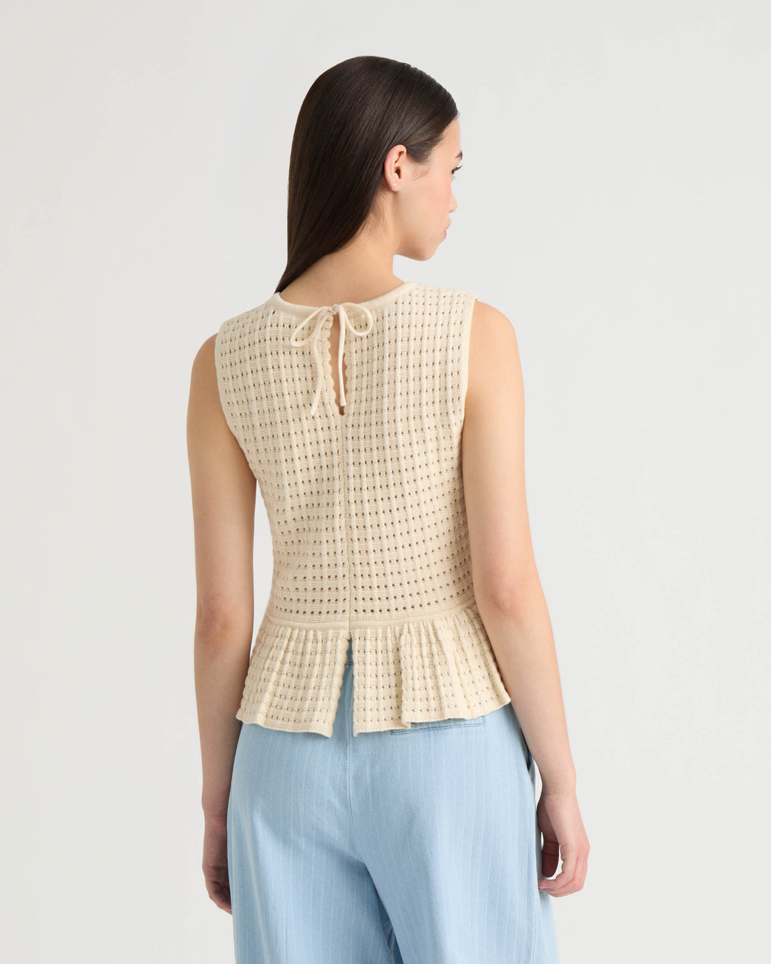 Sleeveless Peplum Sweater