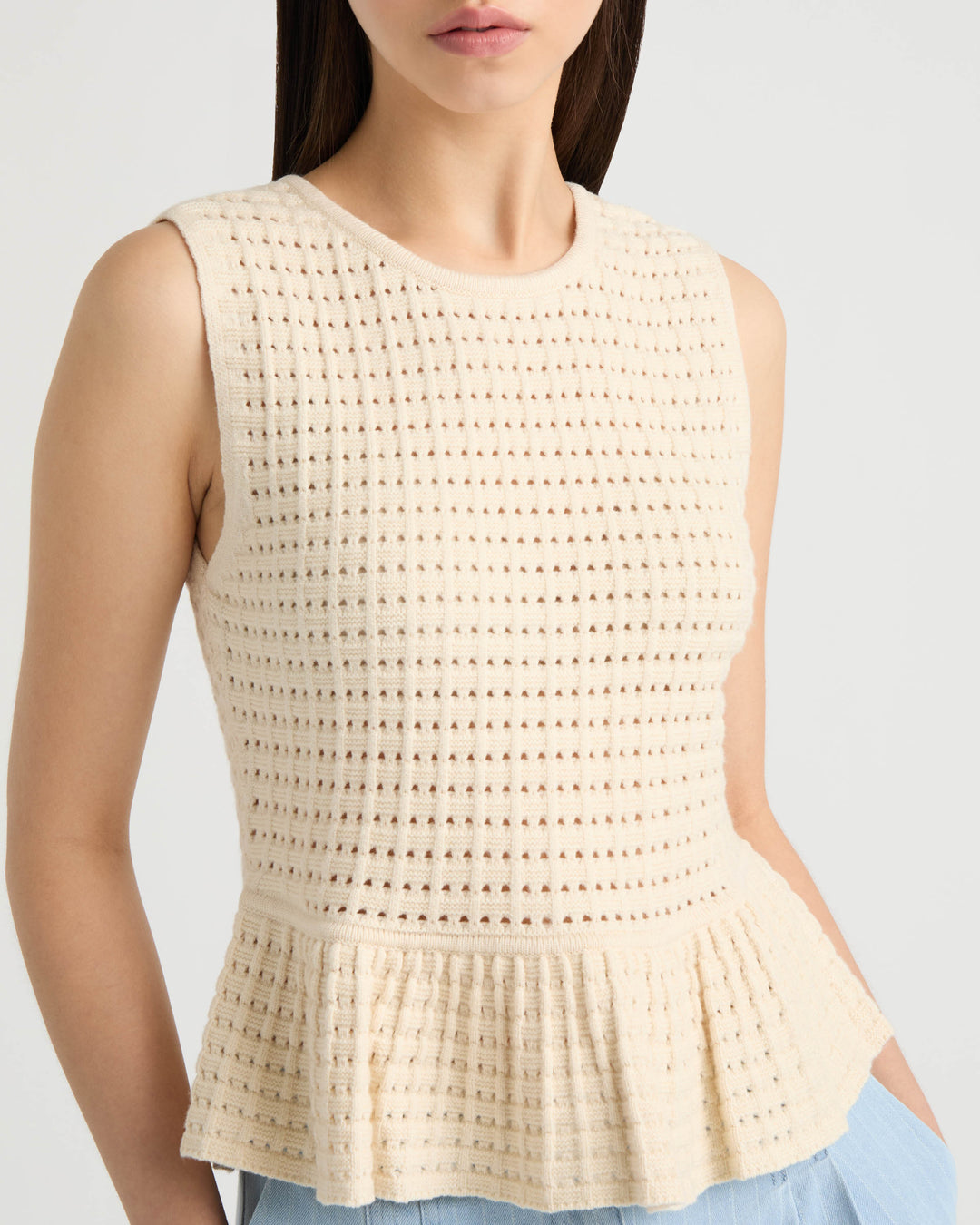 Sleeveless Peplum Sweater