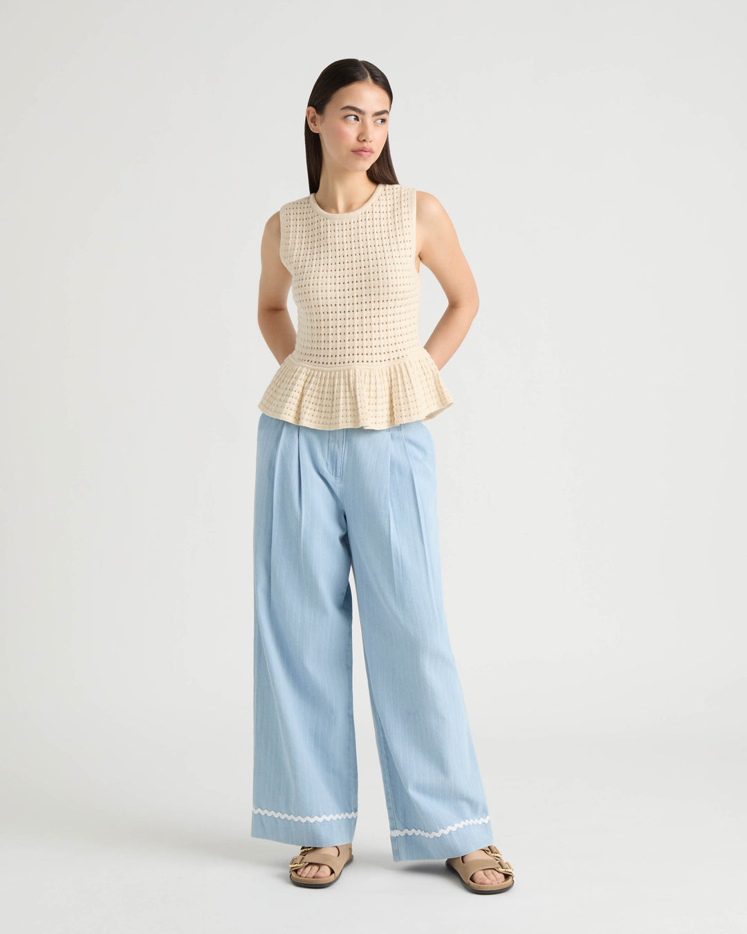Sleeveless Peplum Sweater